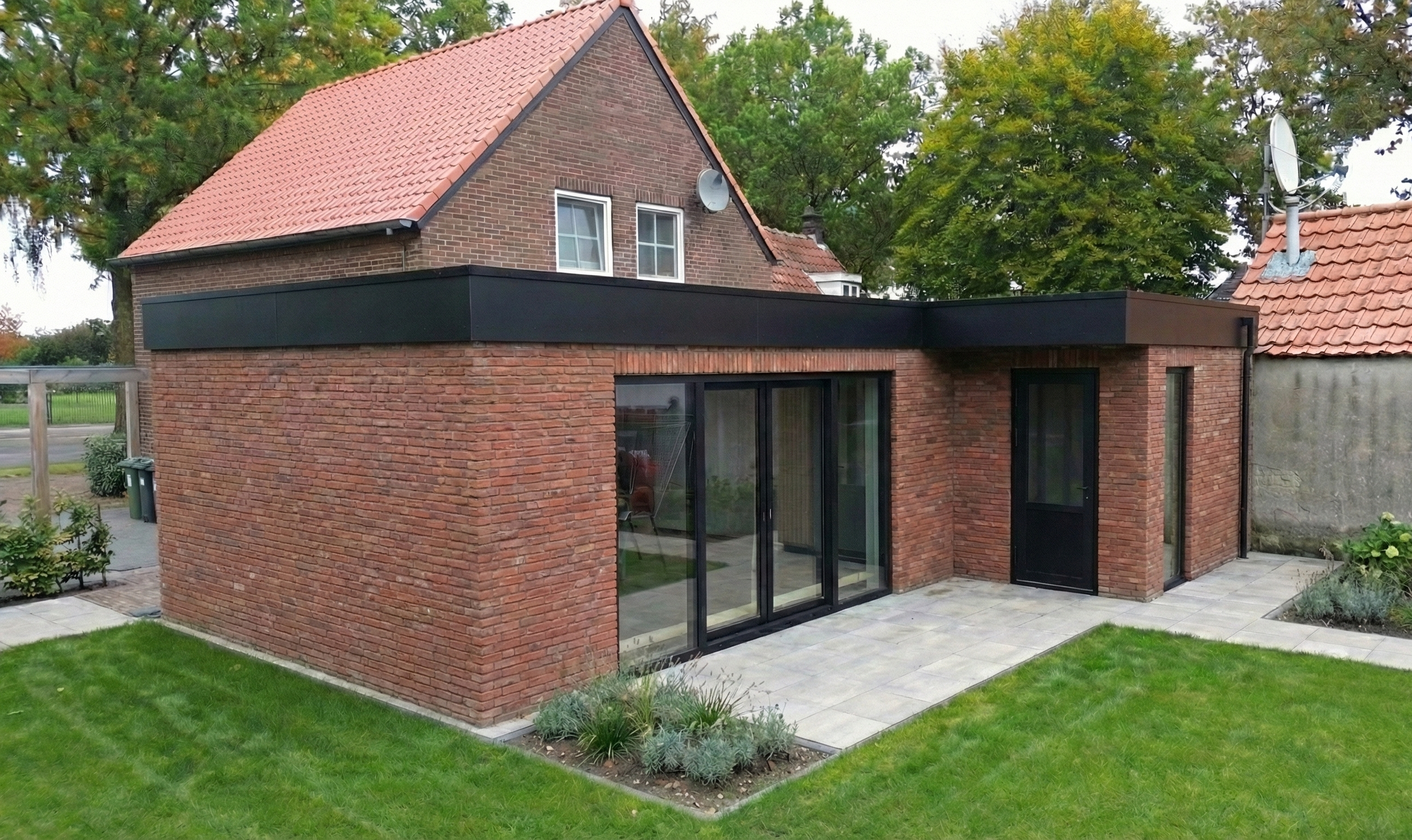L-vormige aanbouw metselwerk